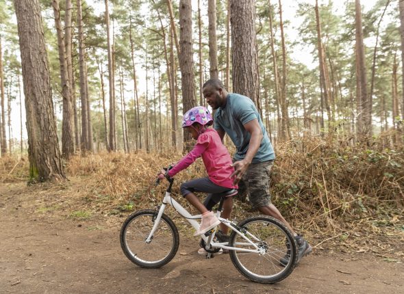 father-preparing-his-kid-bicycle-ride